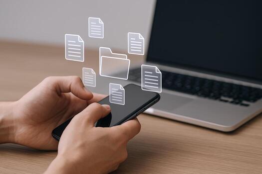 Man Holding Smartphone with Digital Document Icons Displayed, with Laptop, Emphasizing Data Management photo