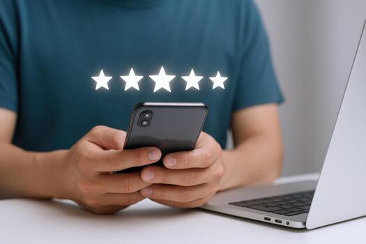 Customer Reviews and Feedback A Man Holding a Smartphone Displaying a Five-Star Rating photo