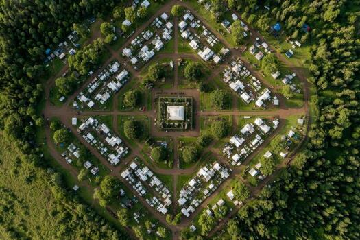An aerial view of a large campground surrounded by trees photo