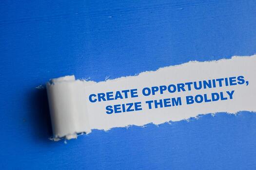 Create opportunities, seize them boldly Text written in torn paper photo