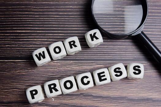 The word Work process on stacked wooden cubes on the table. Business and finance concept photo