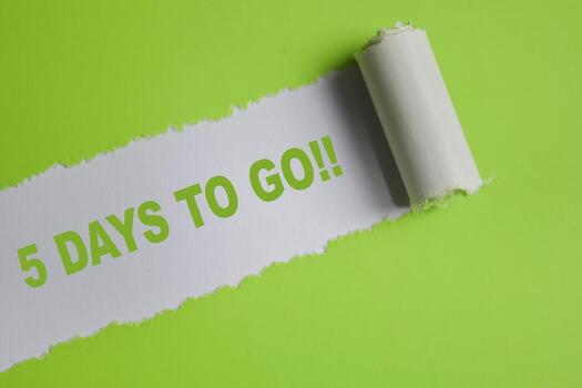 5 Days to go Text written in torn paper photo