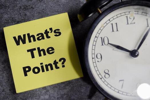 Concept of What's the point write on sticky notes isolated on Wooden Table. photo