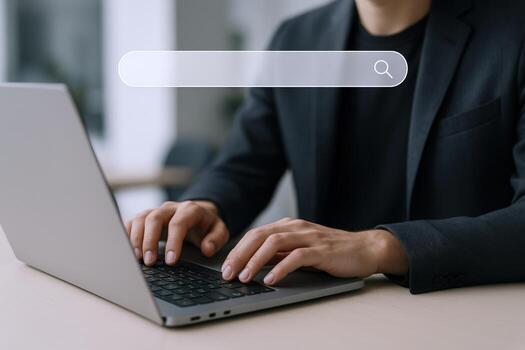 Man Typing on Laptop with Search Bar Overlay Business, Technology, and Information Concept photo