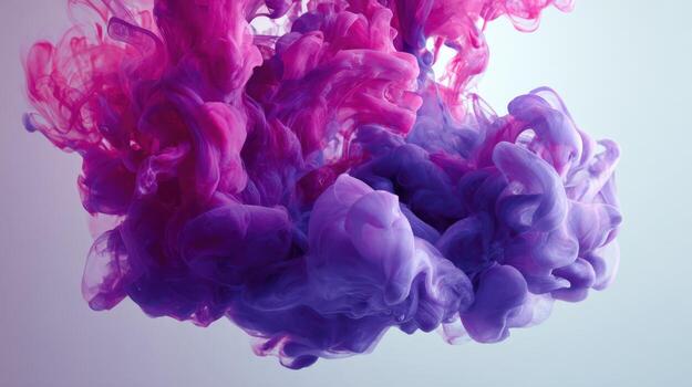 vibrante resumen nube de rosado y púrpura tinta mezcla en agua, creando un arremolinándose efecto foto