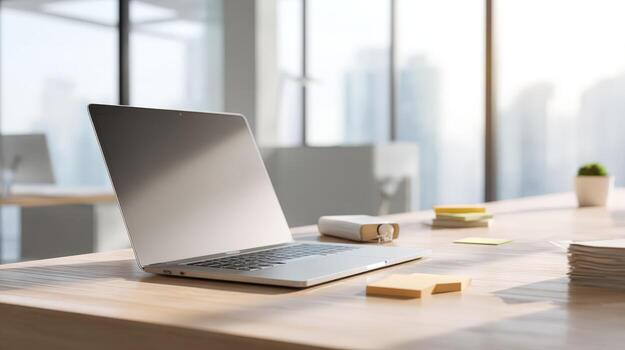 Modern Laptop Computer on Office Desk with Post-it Notes and Supplies, Work From Home photo
