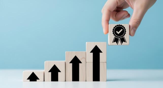 Hand places quality assurance block on growth bar chart, symbolizing success and process improvement photo