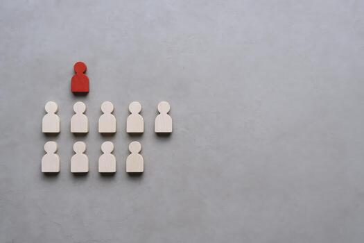 Hierarchy Concept with Wooden Figures Leadership, Management, and Team Structure on a Gray Background photo