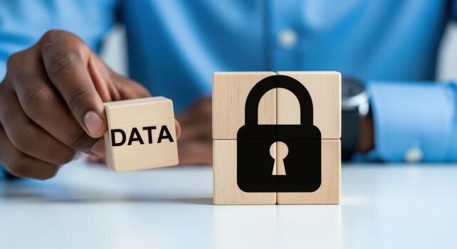 Data Security Concept Man Holding Block with Word Data near Padlock Symbol on Wooden Blocks photo