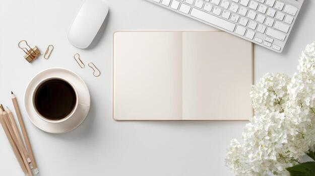 Elegant Workspace Composition Featuring Blank Notebook, Coffee, and Floral Accents on a White Surface photo