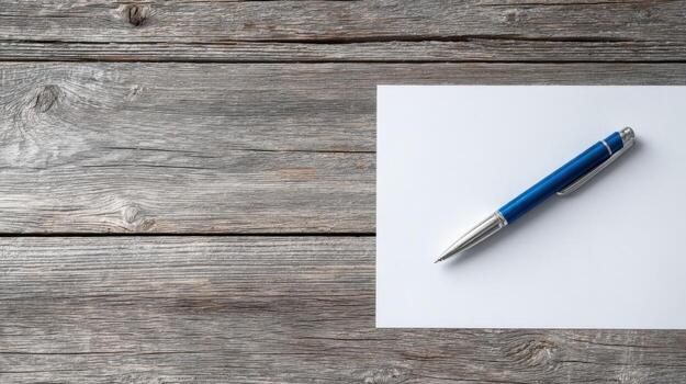 Blue Pen on White Paper with Rustic Wooden Background for Business and Creative Concepts photo
