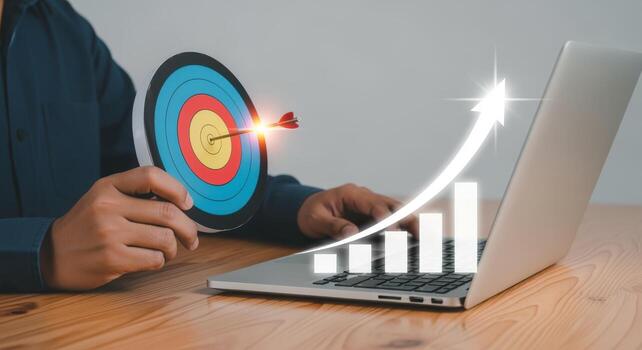 Business Strategy Visualization Arrow Hitting Target, Growth Chart on Laptop Screen Representing Success photo