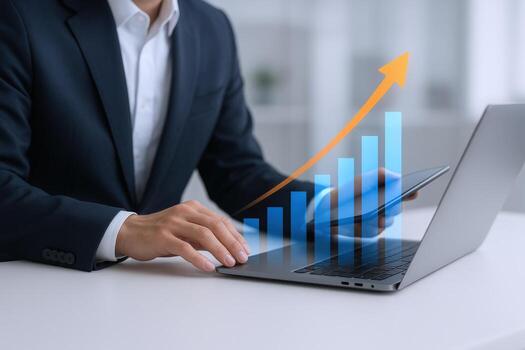 Business Growth Concept Man Using Laptop with Ascending Bar Graph and Arrow Overlaying the Screen photo