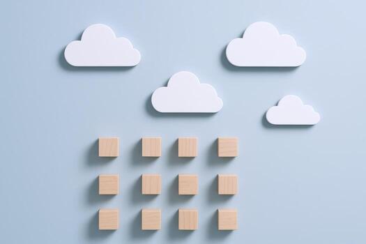 Conceptual Cloud Computing Graphic Wood Cubes Arranged Under White Cloud Shapes on Blue Background photo