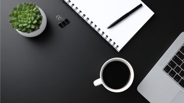 Workplace essentials Top-down view of laptop, notebook, coffee and succulent on a sleek black desk photo
