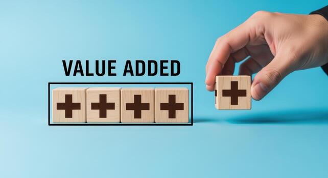 Value Added Concept Hand Arranging Wooden Blocks with Plus Signs on a Blue Background photo