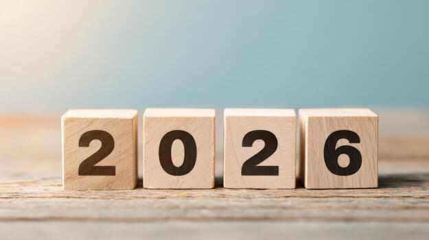Wooden Blocks Displaying Year 2026 on Table, Representing Future Vision and Planning for the Upcoming Year photo