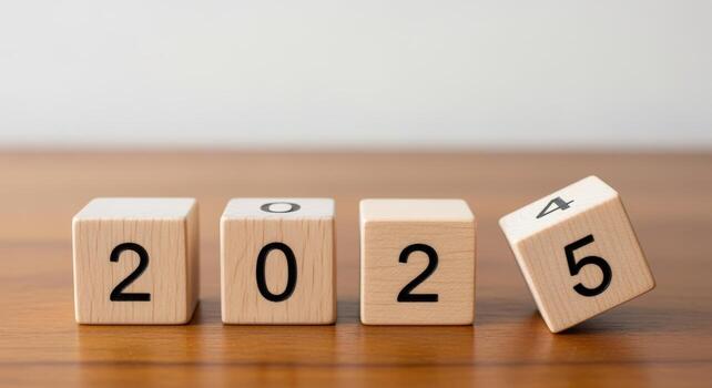 Wooden Blocks Displaying the Year 2025 on a Wooden Surface, Symbolizing the New Year photo