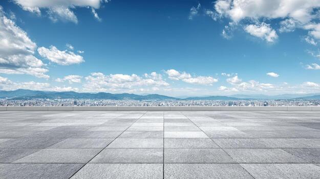 Open Concrete Platform with Distant Cityscape Under a Bright Blue Sky with White Clouds photo