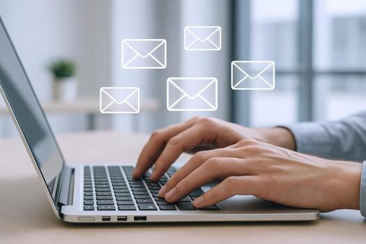 Hands Typing on Laptop with Email Icons Communication and Digital Marketing Concept photo