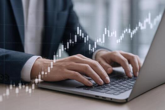 Businessman Analyzes Financial Data, Typing on Laptop with Stock Market Overlay for Investment Insights photo