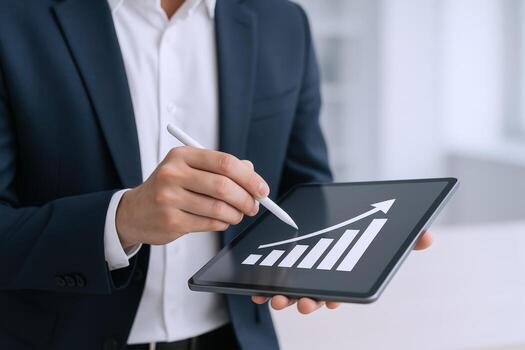 Business Professional Analyzing Growth Chart on Tablet Device, Demonstrating Positive Financial Performance and Strategy, Wearing Suit photo