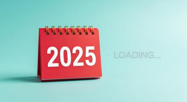 Red Desktop Calendar Showing 2025 with Loading Text, Representing Anticipation, Future Planning, and New Year Aspirations on Blue Background photo