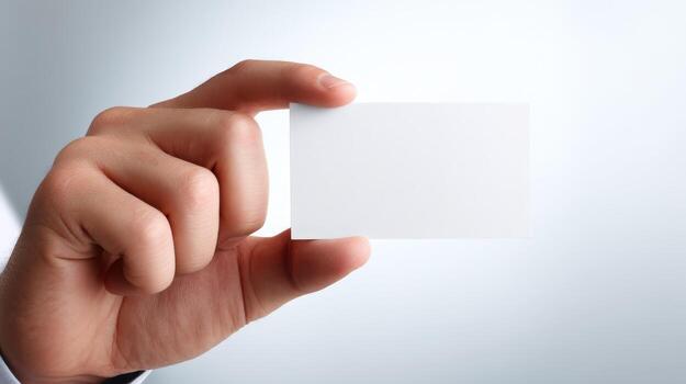 Hand Holding a Blank White Business Card Mockup for Branding and Promotion, Ready for Customization photo