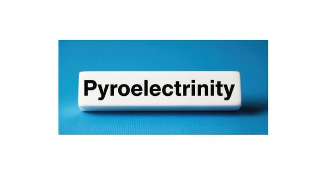 Pyroelectricity Concept Displayed on White Block Against Blue Background, Illustrating Thermal to Electrical Energy Conversion photo