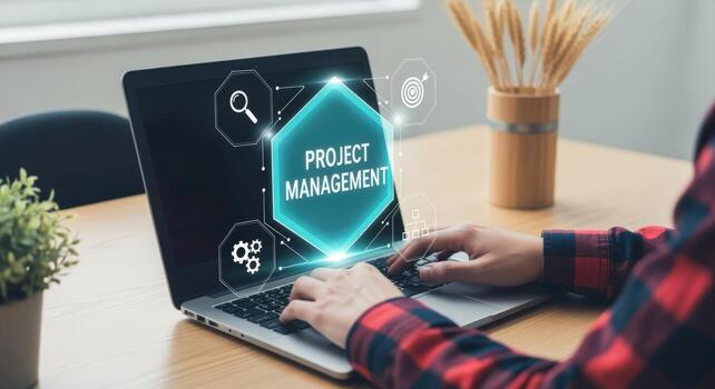 Person using laptop showing project management concept with icons for planning and tracking progress photo