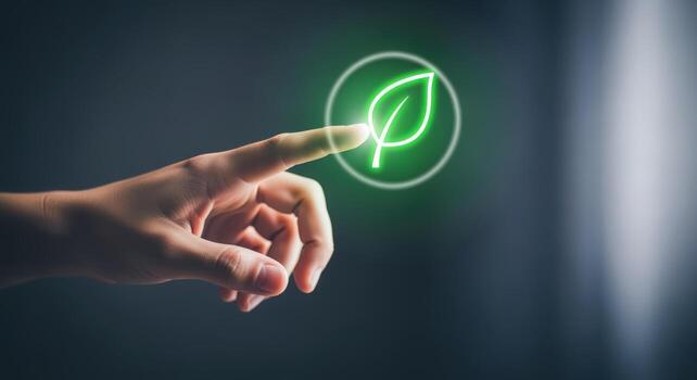 Hand Pressing Green Leaf Button Sustainable Technology and Eco-Friendly Solutions Concept for Environmental Awareness photo