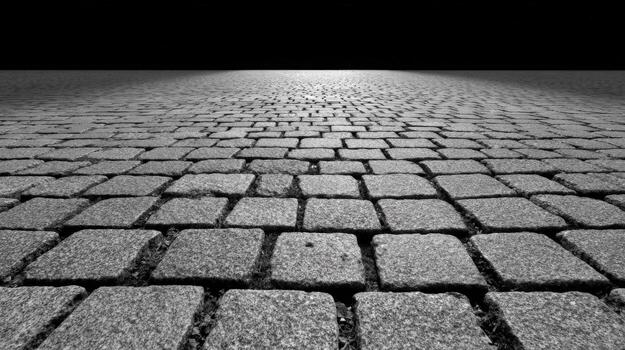 Monochrome Cobblestone Path Leading to a Dark Horizon, Representing Future, Unknown, or Possibilities photo