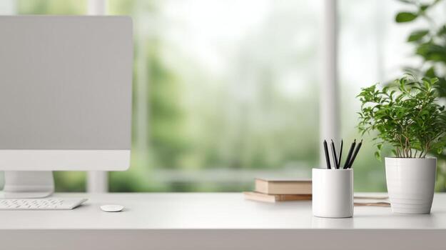 Clean Workspace Mockup Featuring a Desktop Computer, Plant, and Pencils Against a Blurred Background photo
