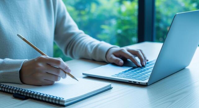 Remote Worker Engaged in Online Meeting and Note Taking, Creating a Digital Document photo