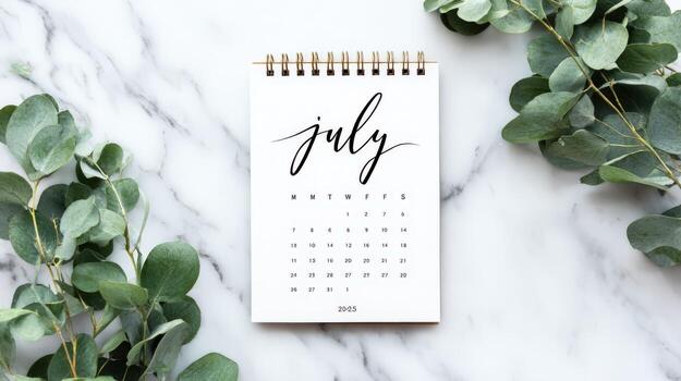 July Calendar Mockup with Eucalyptus on Marble Background, Schedule Planning and Organization, Top View photo