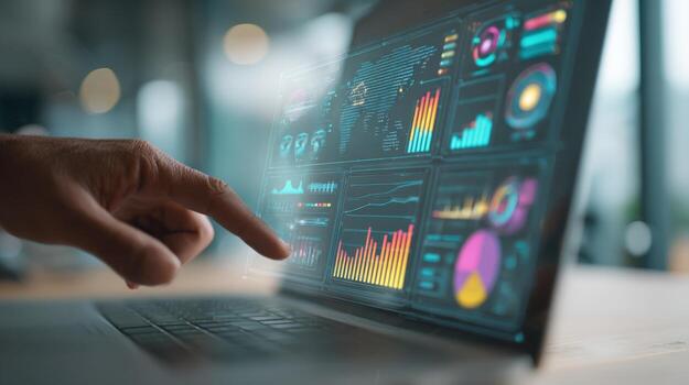 Data Analysis on Laptop Screen Displaying Charts and Graphs with a Hand Pointing at Metrics photo