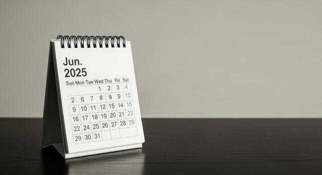 June 2025 Desk Calendar Display, Appointment Scheduling and Planning Future Events, Time Management Conceptual Image photo