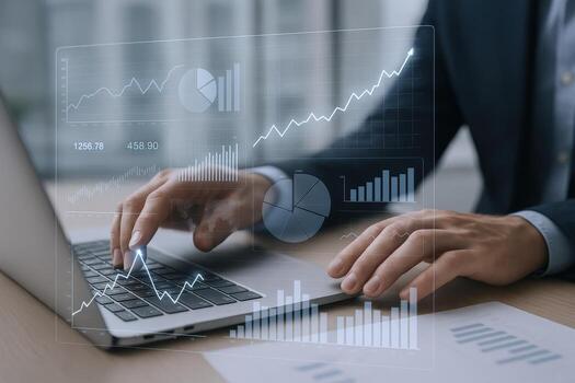Business Analytics Financial Growth Charts Displayed Over a Professional Using Laptop for Data Analysis photo