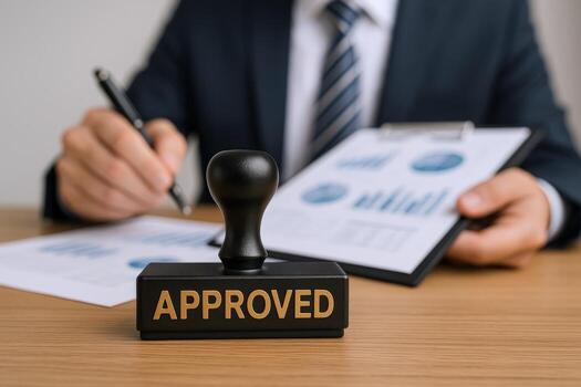 Approved Stamp on Business Report with Executive Holding Pen, Emphasizing Authorization and Compliance photo