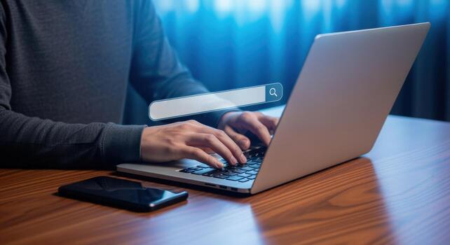 Person Typing on Laptop with Search Bar Overlay for Online Research and Information Access photo