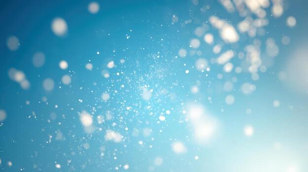 Abstract Light Blue Bokeh Background with Sparkling White Particles for Festive and Celebratory Designs photo