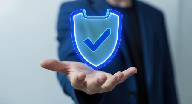 Digital Security Protection A Man Holds a Glowing Shield Representing Cybersecurity and Data Protection photo