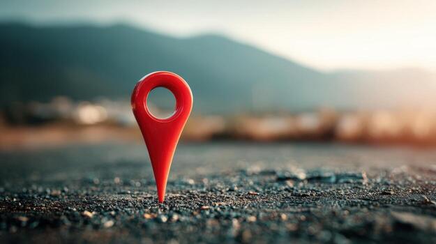 Red Location Pin on Rough Asphalt Road with Mountains Background for Navigation and Travel Concept photo