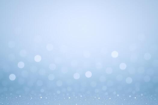Elegant Light Blue Bokeh Background with Sparkling Effect for Festive and Dreamy Designs photo