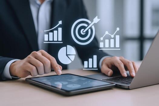 Businessman Analyzing Data with Tablet and Laptop, Showing Growth Charts and Target Achievement for Business Development photo