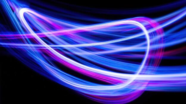 Dynamic Light Painting Abstract Swirls of Blue, White, and Magenta Creating Energy and Movement on Black photo