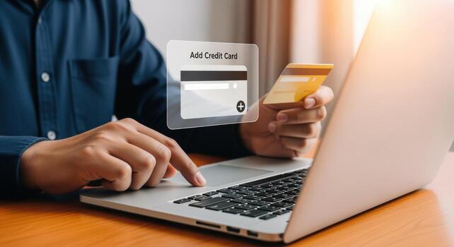 Online Payment with Laptop Man Adds Credit Card for Secure Digital Transaction on Computer photo