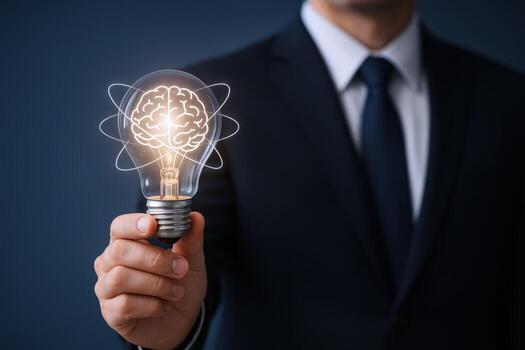 Illuminating Innovation Businessman Holds Glowing Lightbulb with Brain Symbolizing Creative Ideas and Breakthrough Solutions photo