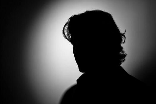 Silhouette of a Mans Face in Dramatic Lighting, Creating a Mysterious and Intriguing Portrait photo