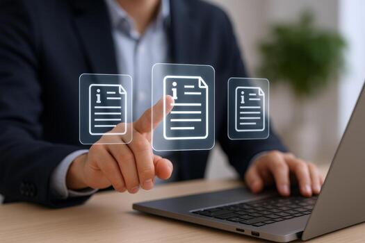 Businessman accessing digital documents on laptop, symbolizing data management and information technology solutions for modern enterprises photo